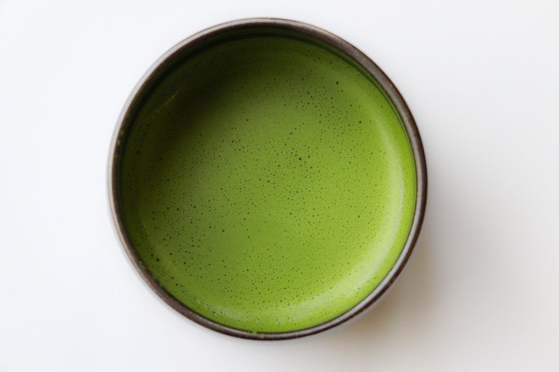A bowl of freshly whisked matcha, seen from above
