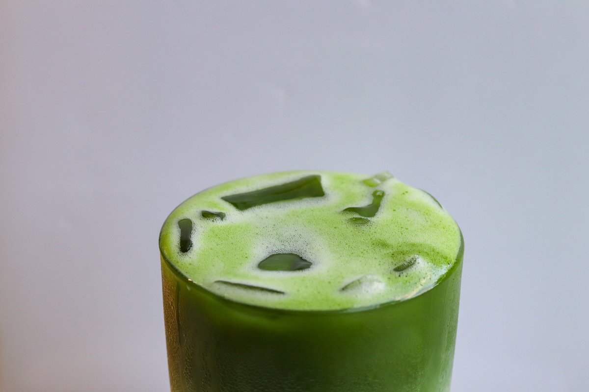 An iced matcha latte in a tall glass